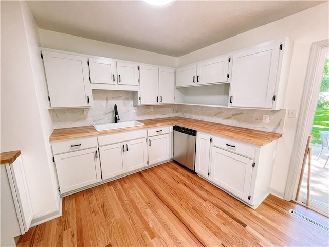 408 W 101st Ter, Kansas City, MO 64114 - kitchen with white cabinetry, a sink, dishwasher, light wood finished floors, and butcher block countertops