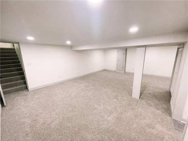 408 W 101st Ter, Kansas City, MO 64114 - finished basement featuring recessed lighting, baseboards, stairway, and light colored carpet