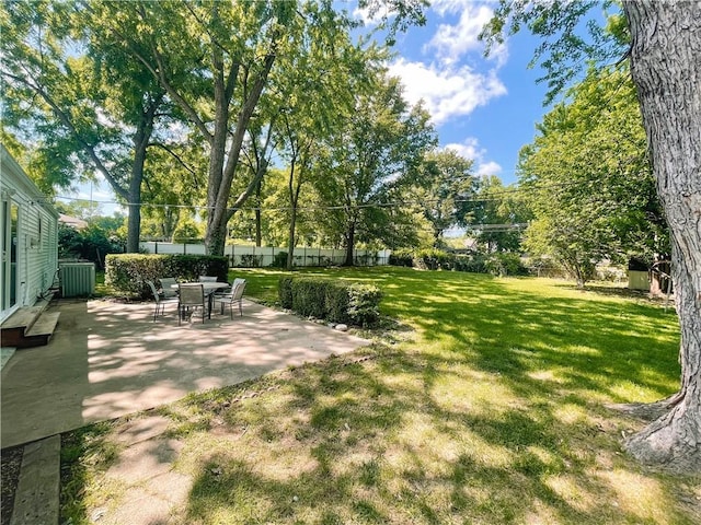 408 W 101st Ter, Kansas City, MO 64114 - view of yard with a fenced backyard, central AC unit, and a patio area