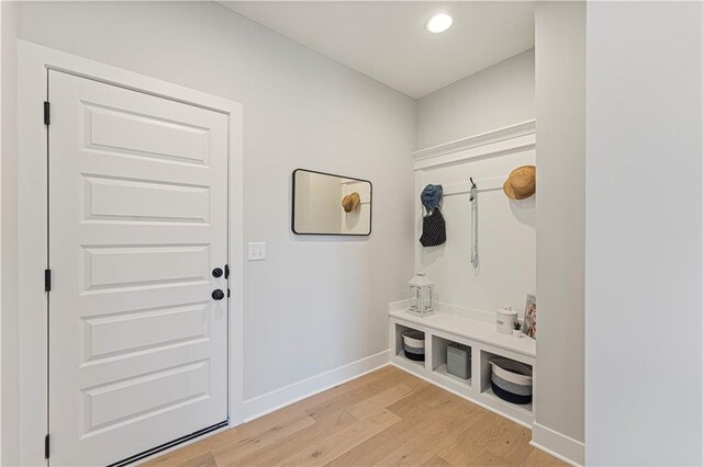 mudroom featuring recessed lighting, baseboards, and light wood-type flooring
