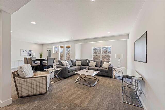 living room featuring recessed lighting, carpet floors, and baseboards