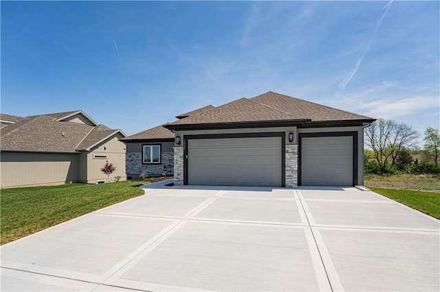 view of front of house with concrete driveway, stone siding, a shingled roof, an attached garage, and a front yard