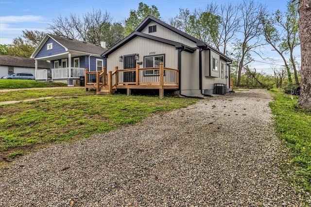 2723 Kimball Ave, Kansas City, KS 66104 - view of front of property featuring a deck, cooling unit, and driveway