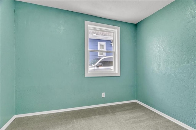 2723 Kimball Ave, Kansas City, KS 66104 - carpeted empty room with baseboards