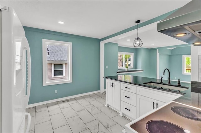 2723 Kimball Ave, Kansas City, KS 66104 - kitchen with white refrigerator with ice dispenser, dark countertops, marble finish floor, and a sink