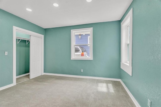 2723 Kimball Ave, Kansas City, KS 66104 - unfurnished bedroom with recessed lighting, a closet, carpet, and baseboards