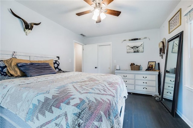312 W Pine St, Butler, MO 64730 - bedroom with dark wood finished floors, ceiling fan, baseboards, and a closet