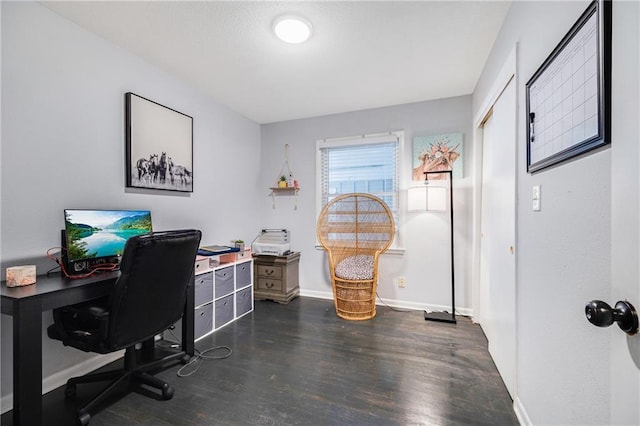 312 W Pine St, Butler, MO 64730 - home office with dark wood-style flooring and baseboards