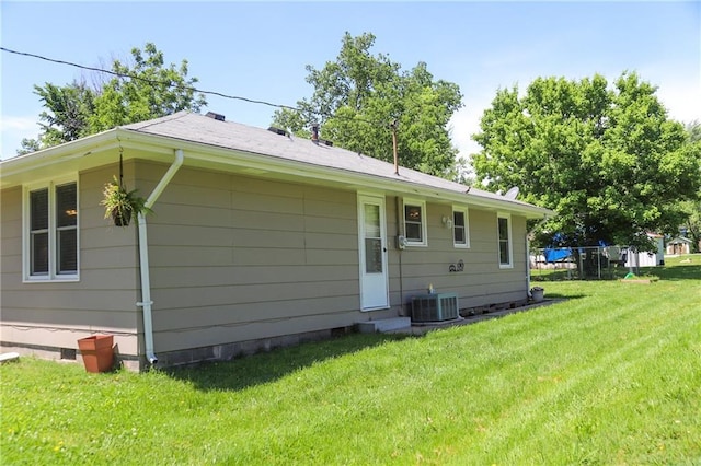 312 W Pine St, Butler, MO 64730 - back of house featuring crawl space, a yard, cooling unit, and entry steps