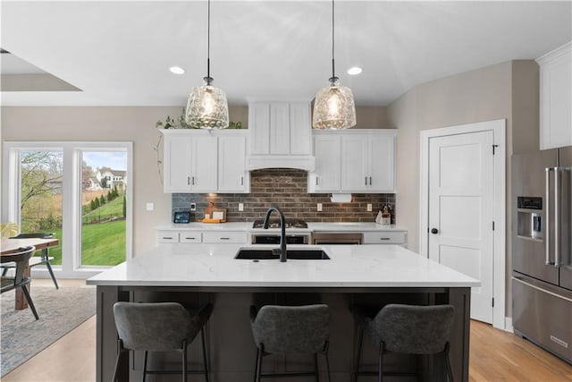 5566 Thousand Oaks Dr, Parkville, MO 64152 - kitchen with white cabinetry, high end fridge, and a sink