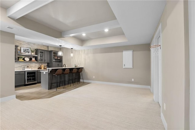 5566 Thousand Oaks Dr, Parkville, MO 64152 - bar with beamed ceiling, indoor wet bar, wine cooler, tasteful backsplash, and baseboards