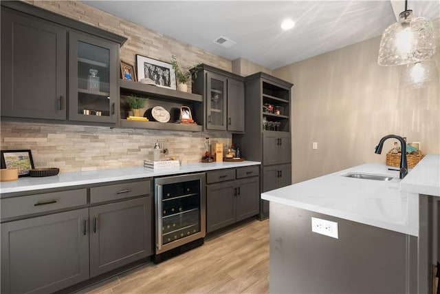 5566 Thousand Oaks Dr, Parkville, MO 64152 - bar featuring indoor wet bar, a sink, wine cooler, visible vents, and backsplash