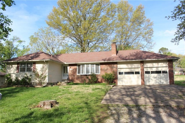 ranch-style house featuring brick siding, a garage, a front yard, a chimney, and driveway