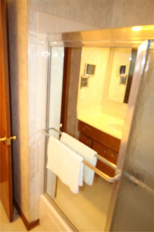full bath with an enclosed shower