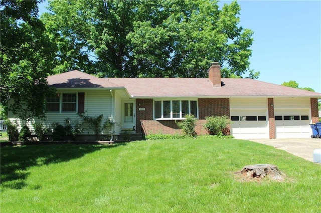 1211 Spruce St, Eudora, KS 66025 - ranch-style home featuring a garage, a chimney, concrete driveway, a front lawn, and brick siding