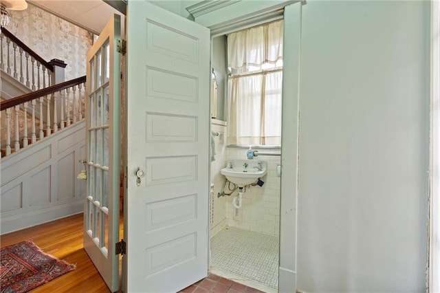 bathroom with wood finished floors and a sink