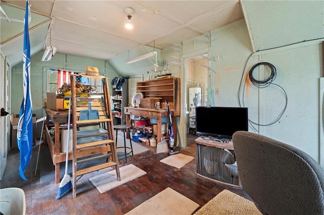 home office featuring hardwood / wood-style flooring and vaulted ceiling
