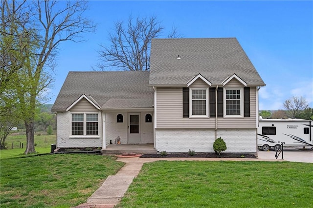 28274 W 311th St, Paola, KS 66071 - tri-level home with brick siding, a front lawn, and a shingled roof