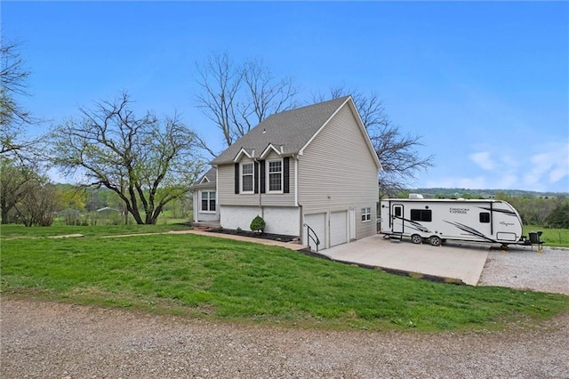 28274 W 311th St, Paola, KS 66071 - view of side of property with a garage, a yard, and driveway