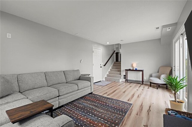 28274 W 311th St, Paola, KS 66071 - living area with light wood-type flooring, stairs, and recessed lighting