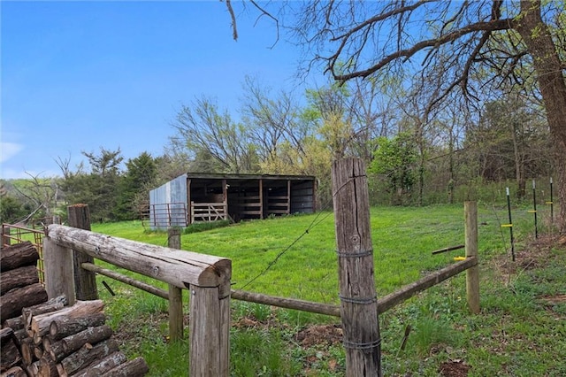 28274 W 311th St, Paola, KS 66071 - view of yard with an outbuilding, a pole building, a view of trees, and an exterior structure