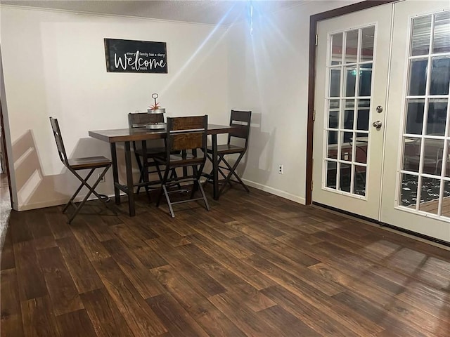 dining room with wood finished floors and baseboards