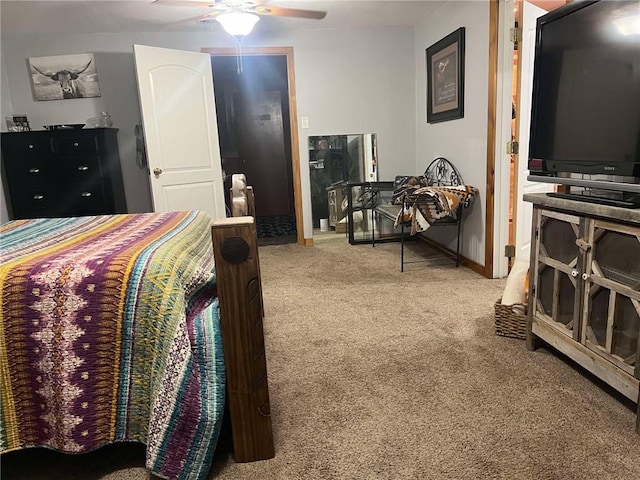 bedroom featuring a ceiling fan, carpet flooring, and baseboards