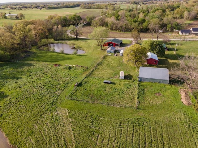 aerial view featuring a rural view and a water view