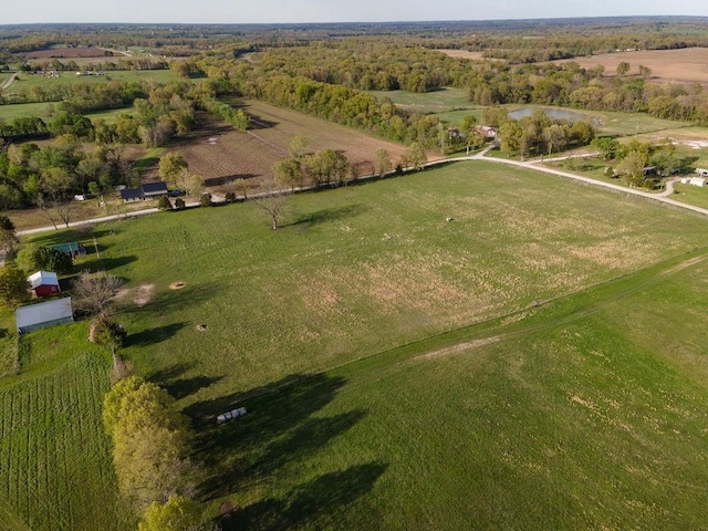 birds eye view of property with a rural view