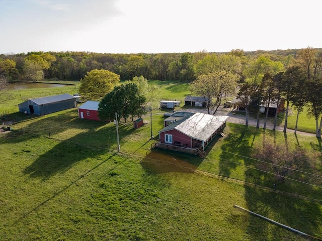 birds eye view of property with a rural view and a water view
