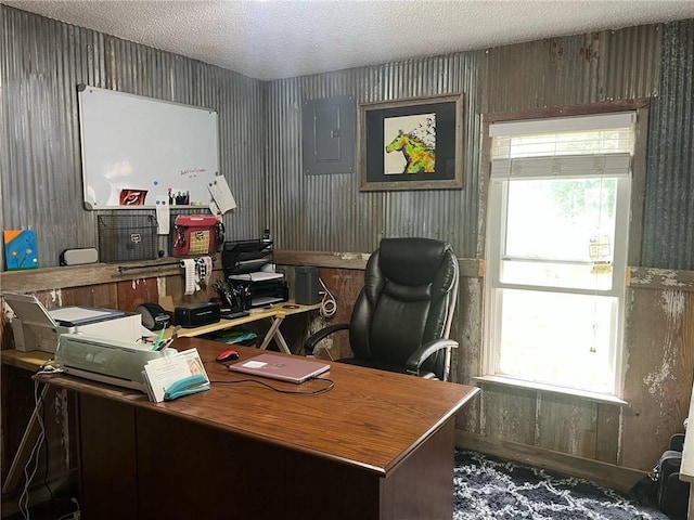 office with a textured ceiling and electric panel
