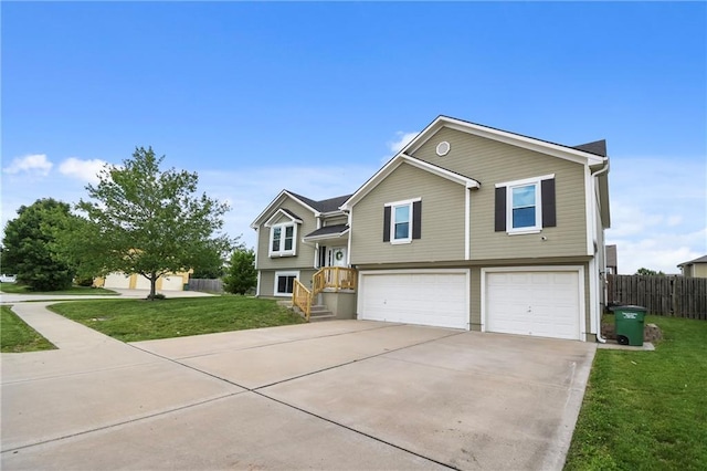 12200 E 214th Ter, Peculiar, MO 64078 - raised ranch featuring a garage and concrete driveway