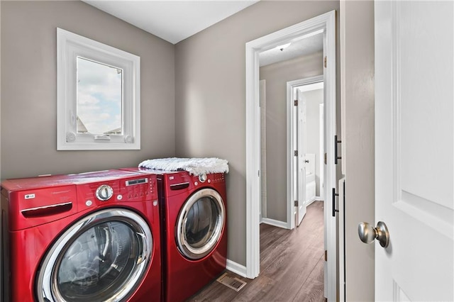 12200 E 214th Ter, Peculiar, MO 64078 - laundry room with washing machine and clothes dryer, dark wood finished floors, and baseboards