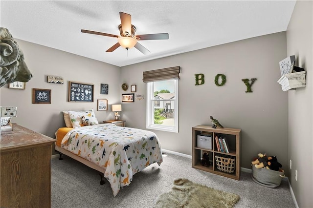 12200 E 214th Ter, Peculiar, MO 64078 - carpeted bedroom featuring baseboards and a ceiling fan