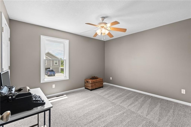 12200 E 214th Ter, Peculiar, MO 64078 - bedroom with carpet floors, baseboards, a textured ceiling, a ceiling fan, and an office area