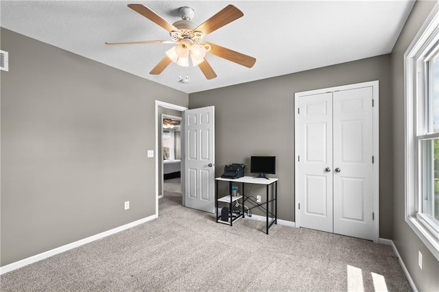12200 E 214th Ter, Peculiar, MO 64078 - carpeted home office with ceiling fan and baseboards