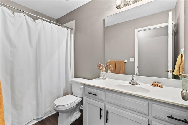 12200 E 214th Ter, Peculiar, MO 64078 - bathroom with vanity, toilet, wood finished floors, and curtained shower
