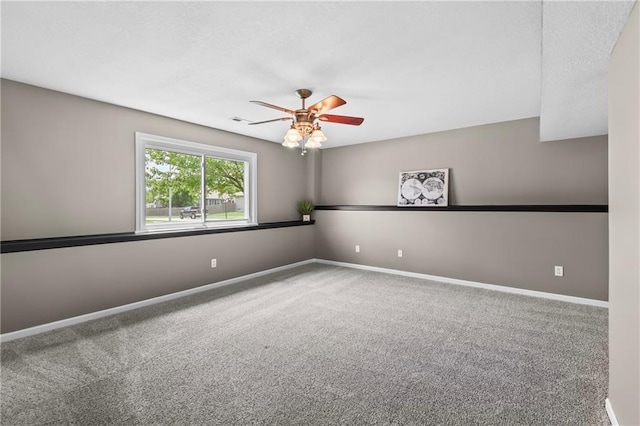 12200 E 214th Ter, Peculiar, MO 64078 - carpeted spare room with a ceiling fan and baseboards