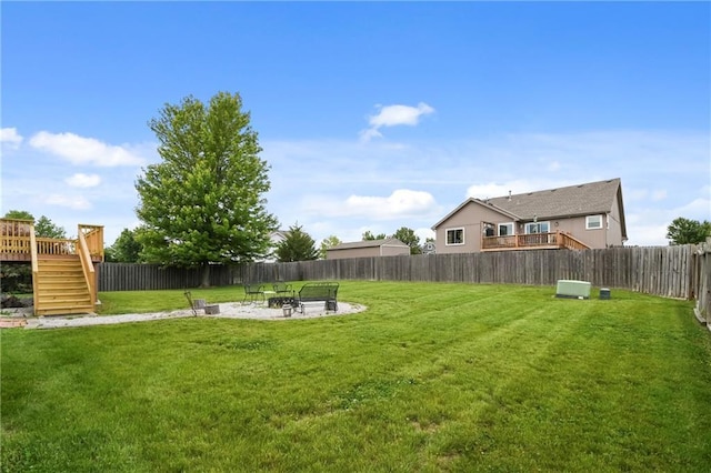 12200 E 214th Ter, Peculiar, MO 64078 - view of yard with stairway, a fire pit, and a deck