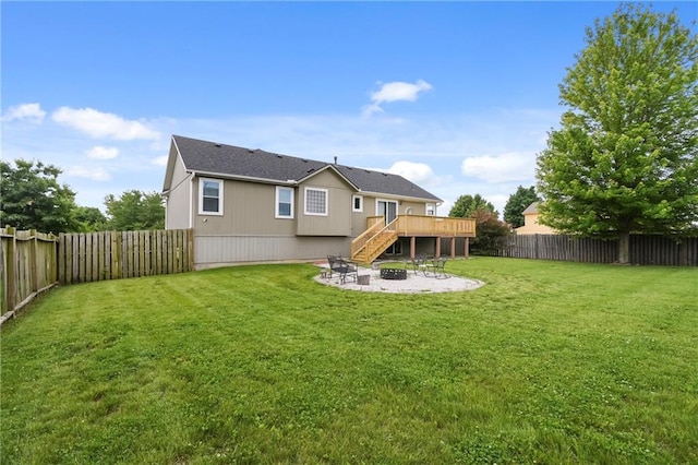 12200 E 214th Ter, Peculiar, MO 64078 - back of property with an outdoor fire pit, a wooden deck, stairs, and a patio