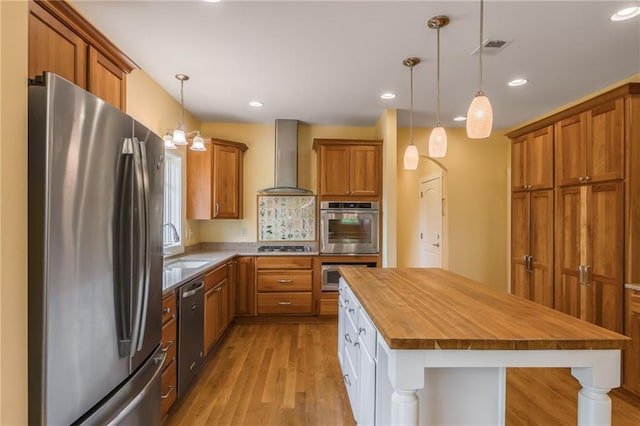 8725 Nebo Hills Rd, Liberty, MO 64068 - kitchen with wall chimney range hood, brown cabinets, appliances with stainless steel finishes, light wood-style floors, and butcher block countertops