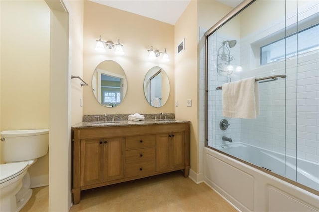 8725 Nebo Hills Rd, Liberty, MO 64068 - full bathroom featuring visible vents, a sink, shower / bath combination with glass door, and toilet