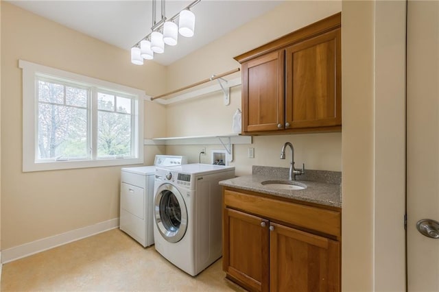 8725 Nebo Hills Rd, Liberty, MO 64068 - washroom featuring baseboards, a sink, cabinet space, and independent washer and dryer