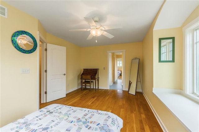 8725 Nebo Hills Rd, Liberty, MO 64068 - bedroom featuring baseboards, ceiling fan, wood finished floors, and visible vents