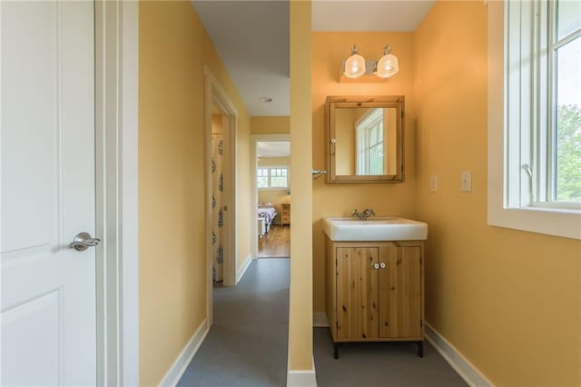 8725 Nebo Hills Rd, Liberty, MO 64068 - bathroom with baseboards, plenty of natural light, and vanity