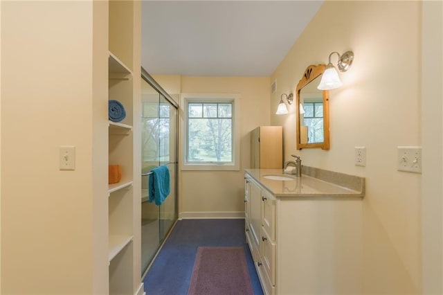 8725 Nebo Hills Rd, Liberty, MO 64068 - bathroom with vanity, a shower with door, and baseboards