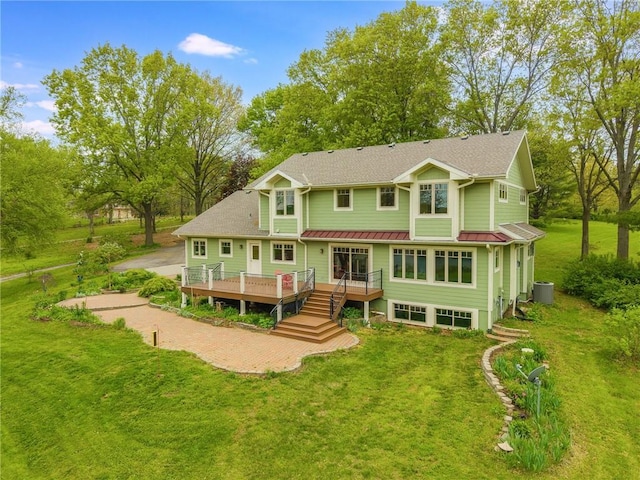 8725 Nebo Hills Rd, Liberty, MO 64068 - rear view of property with a standing seam roof, a deck, central air condition unit, a yard, and metal roof