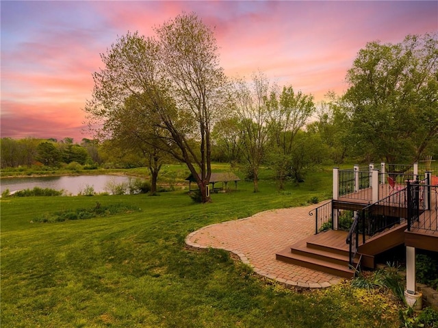 8725 Nebo Hills Rd, Liberty, MO 64068 - yard at dusk featuring a deck with water view