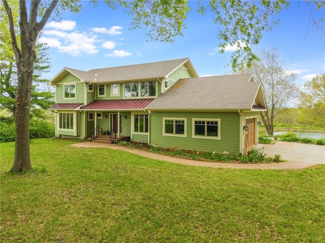 8725 Nebo Hills Rd, Liberty, MO 64068 - view of front of house featuring a water view, a garage, driveway, and a front yard