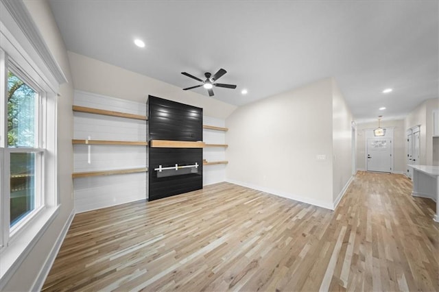 unfurnished living room featuring light wood-type flooring, ceiling fan, recessed lighting, and baseboards